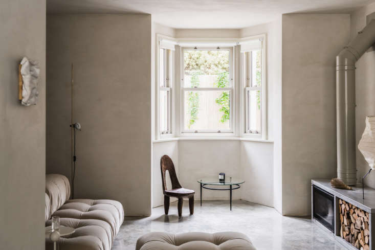 limewashed walls and concrete floors pair well in this daytrip studio designed  20